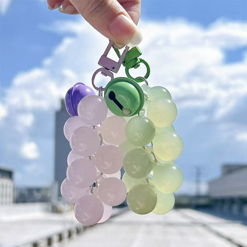 UV color changing acrylic grape keychain in transparent green and purple