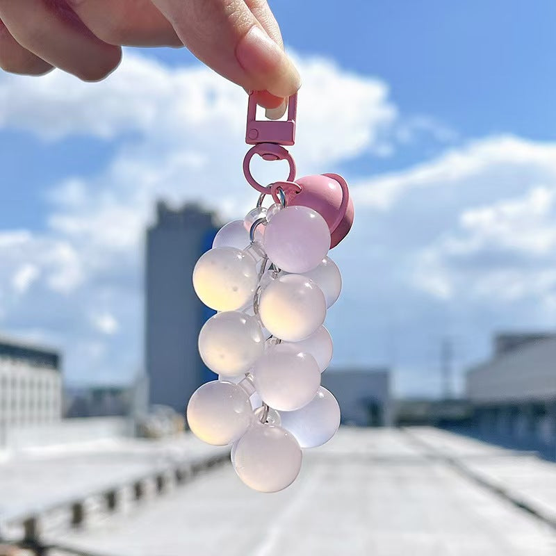 Pink UV reactive grape bead keychain for bags and phones