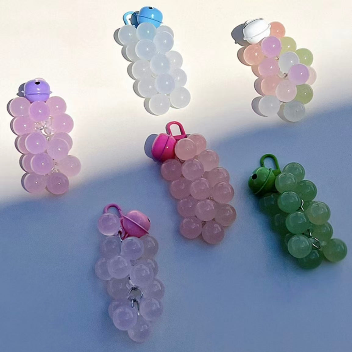 UV color changing acrylic grape keychain in transparent white