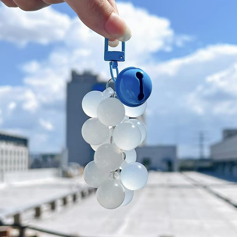 Blue acrylic grape bag charm with UV color changing beads
