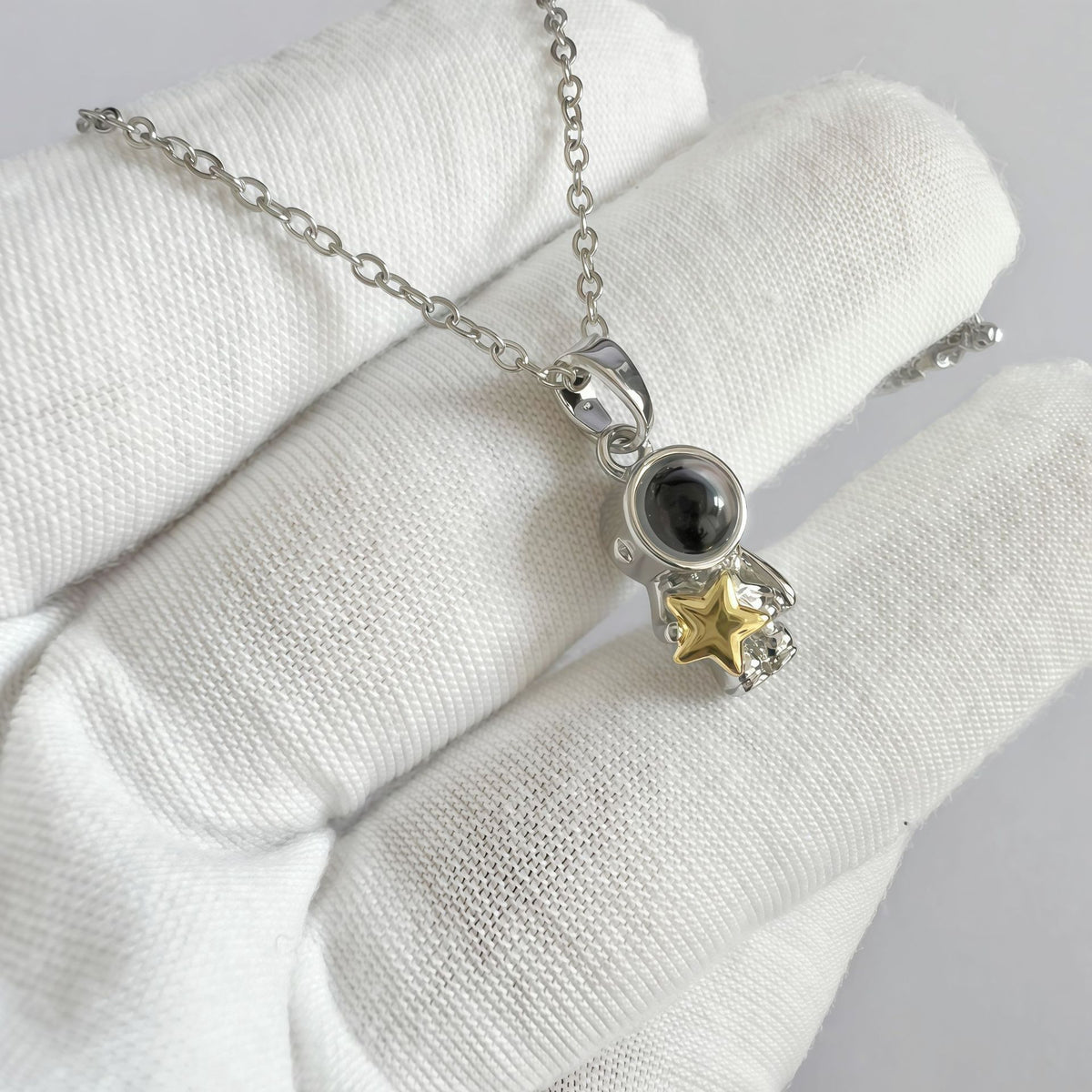 Astronaut necklace with hidden love message projection stone