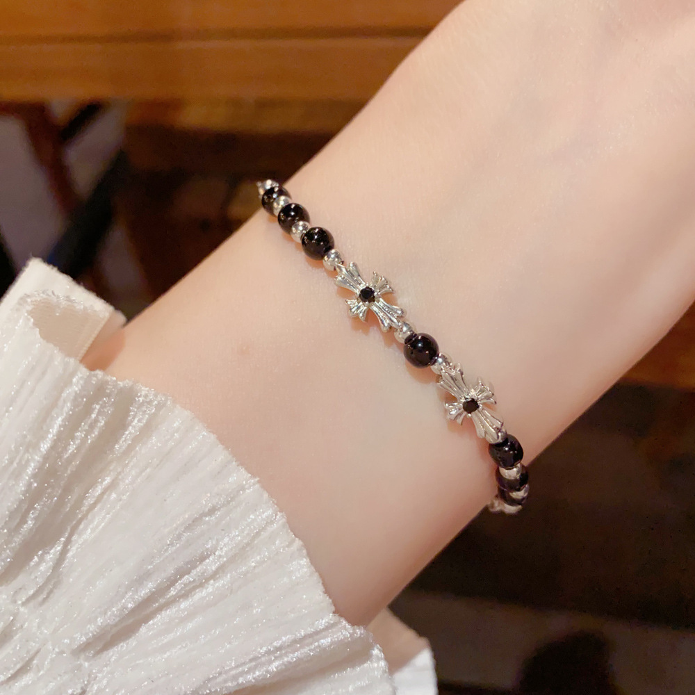 Elegant black bracelet with floral details