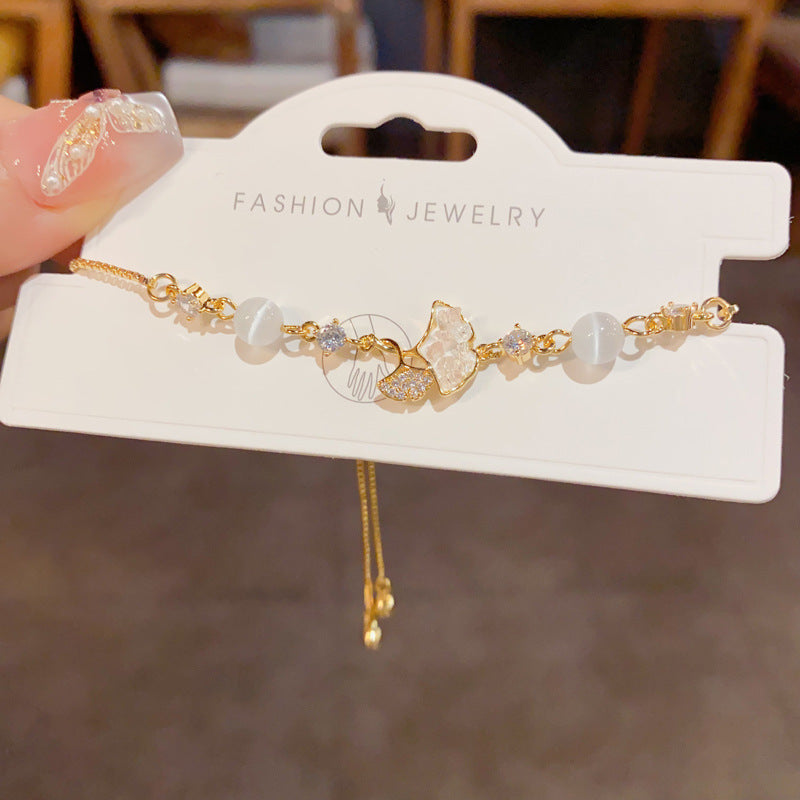 14K gold plated cat’s eye bracelet with crystal maple leaf