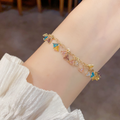 Gold bracelet with colorful triangle charms