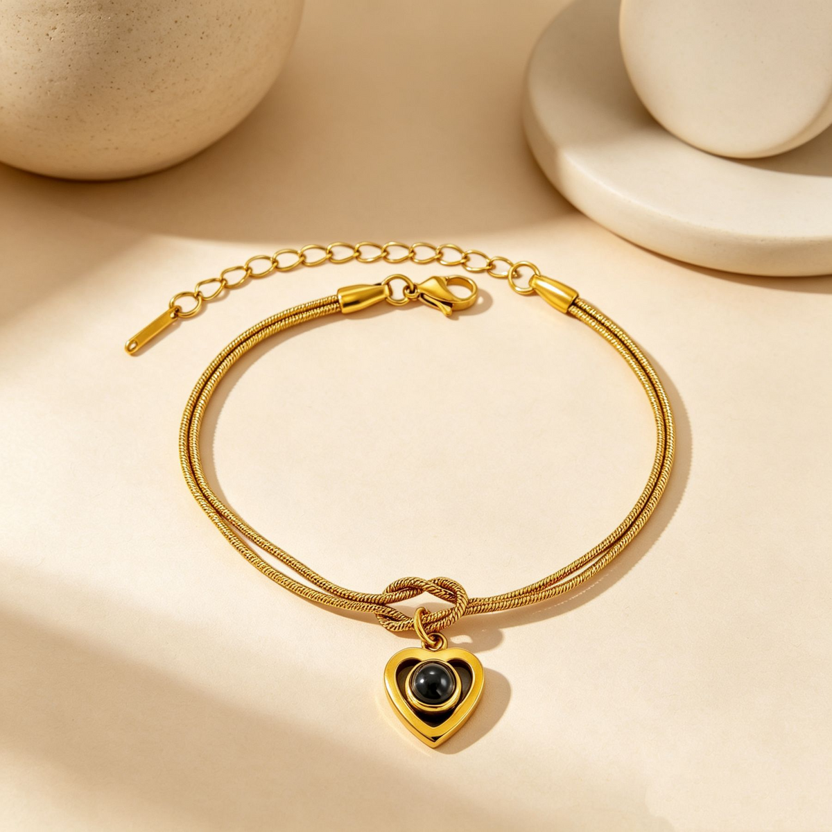 Gold infinity knot heart projection bracelet