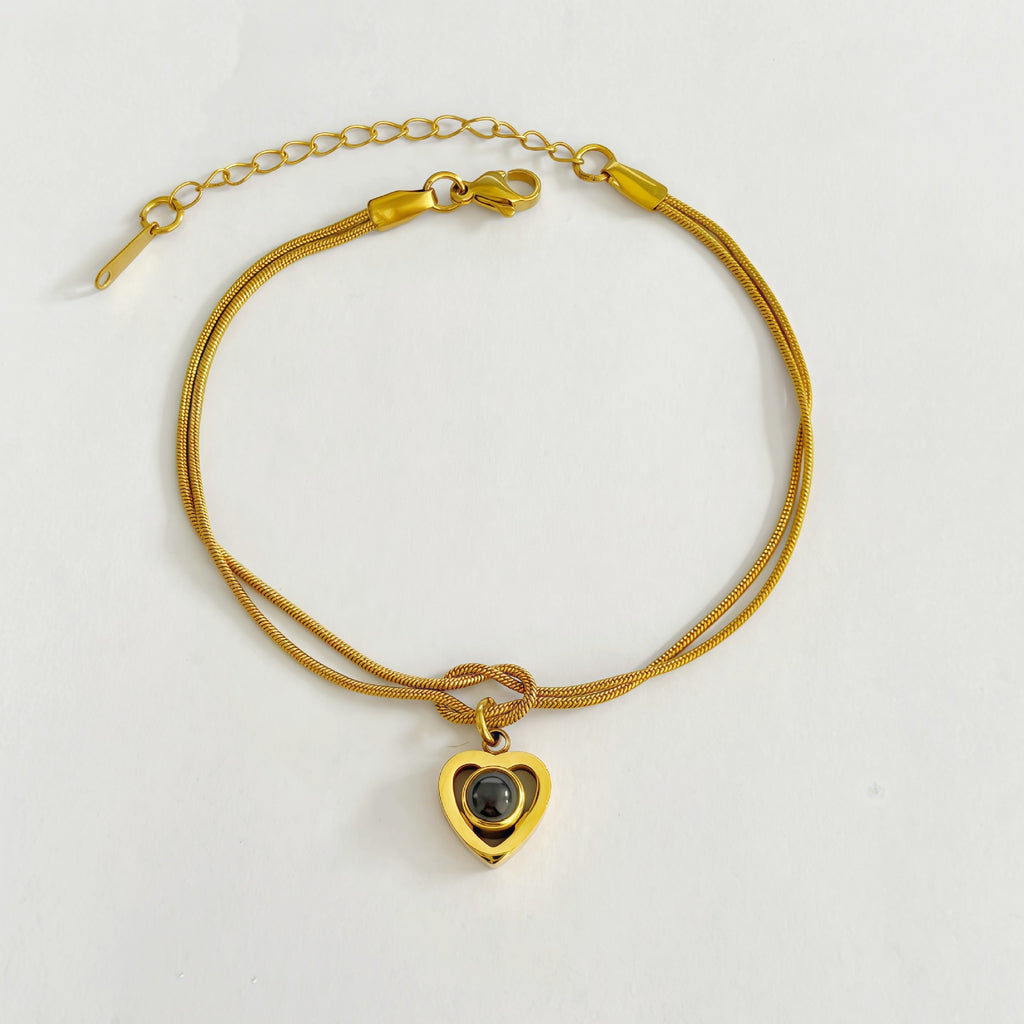 Infinity knot bracelet with custom projection stone
