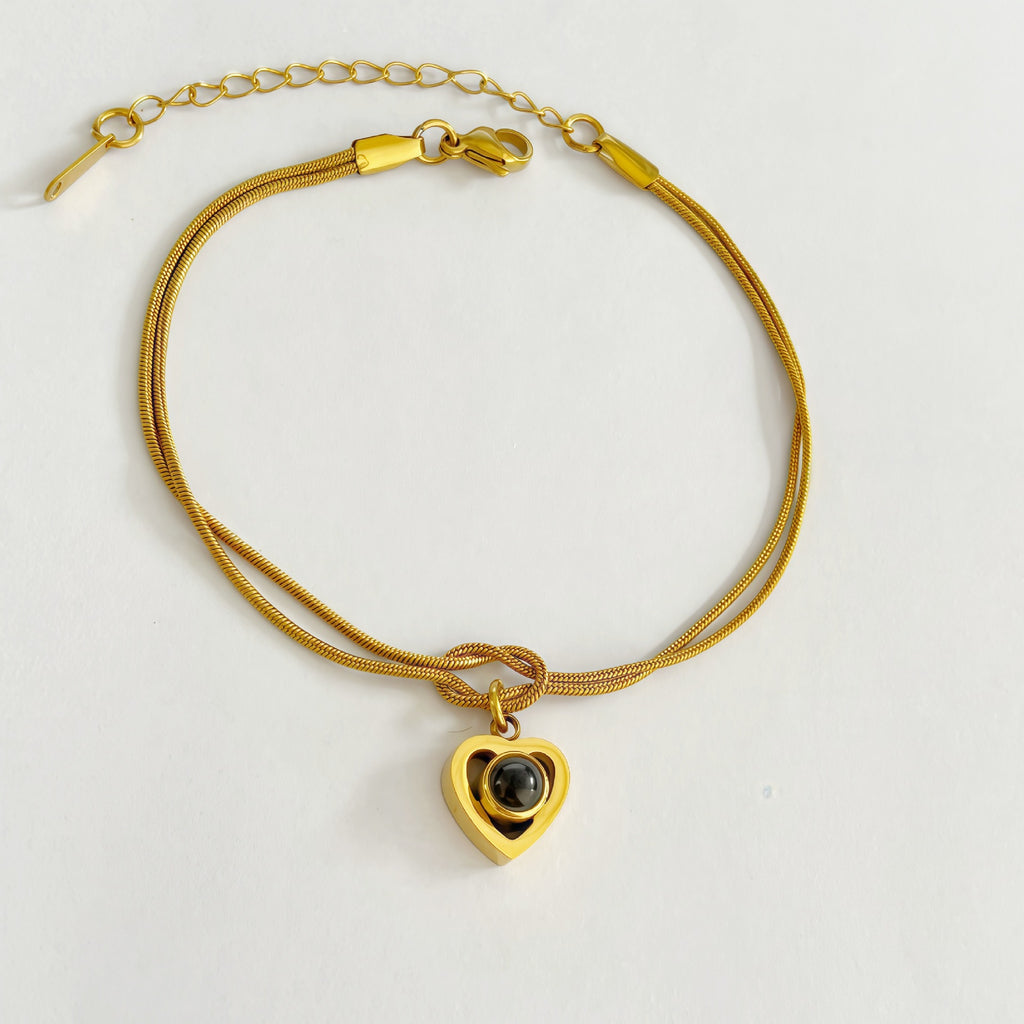 Infinity knot bracelet with custom projection stone