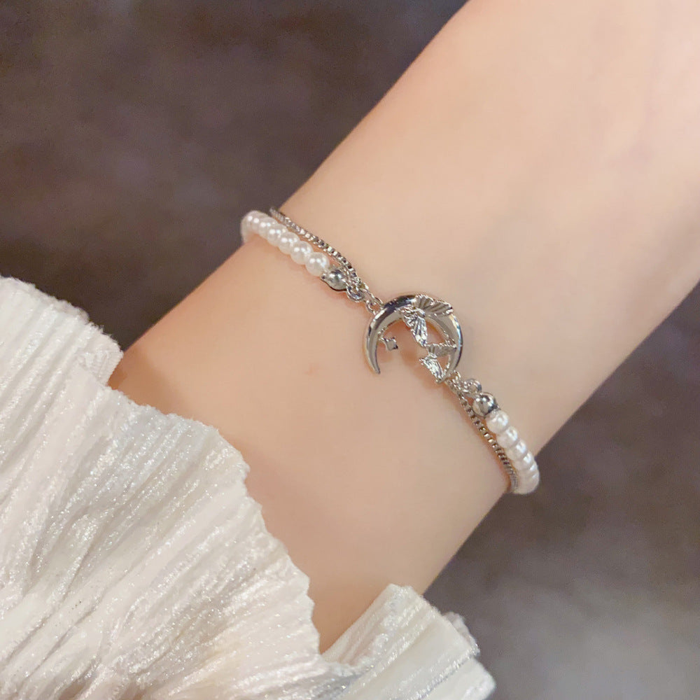 Silver French-inspired pearl butterfly moon bracelet product view