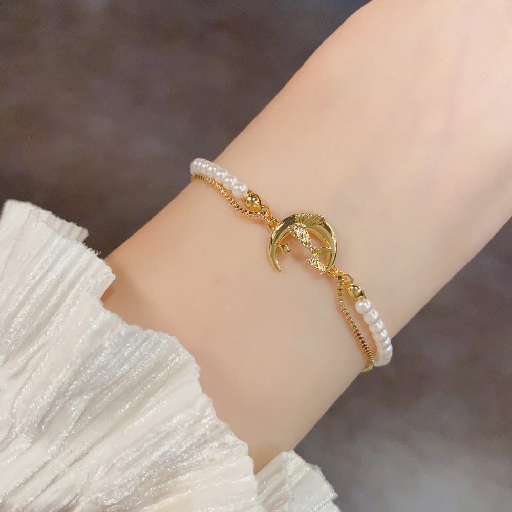 Gold French-inspired pearl butterfly moon bracelet product view