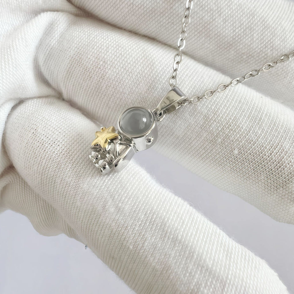 Phone camera showing hidden image inside astronaut pendant