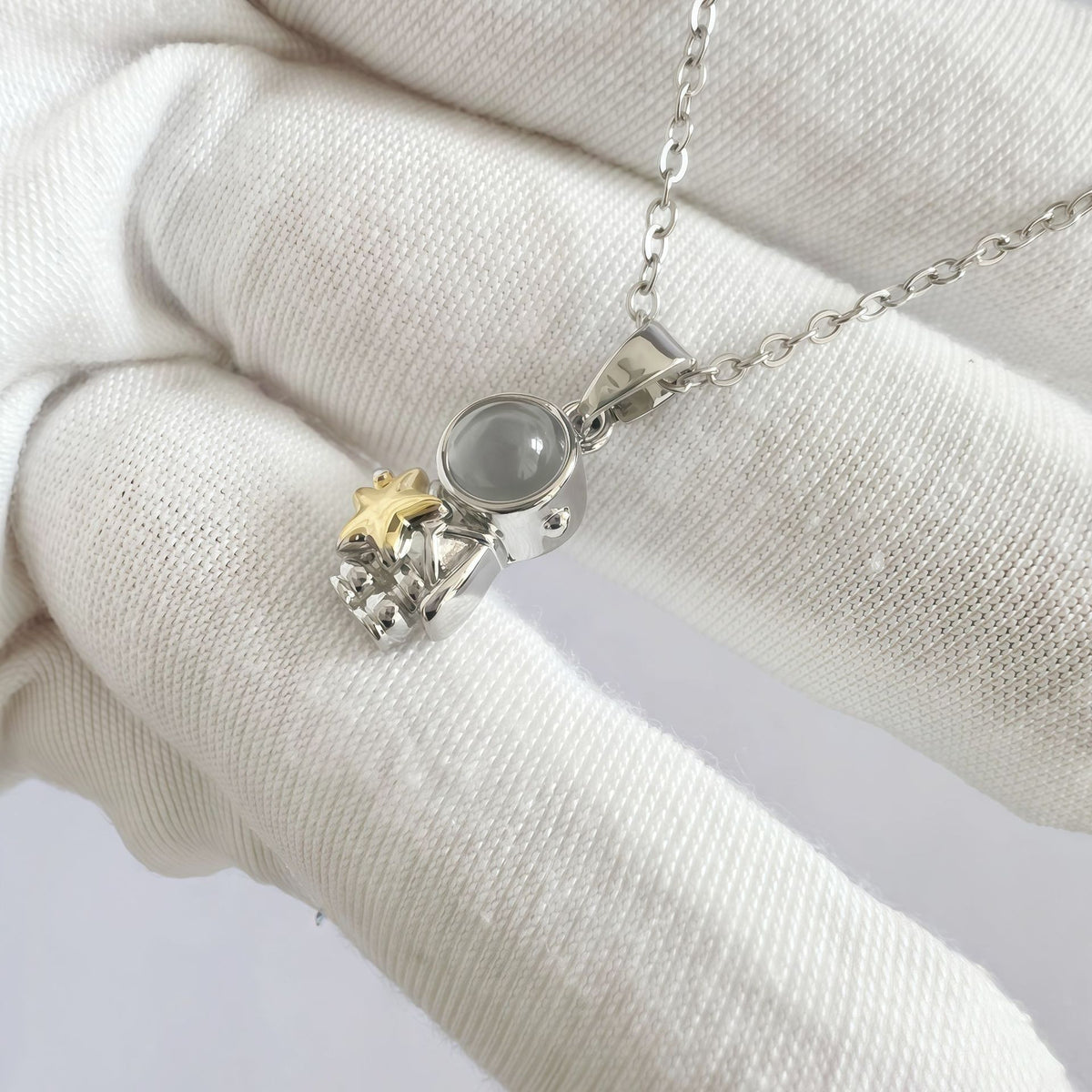 Phone camera showing hidden image inside astronaut pendant