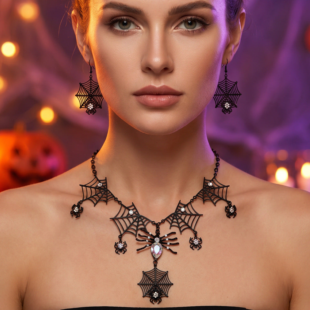 The model is wearing a Halloween spider necklace and earring set.