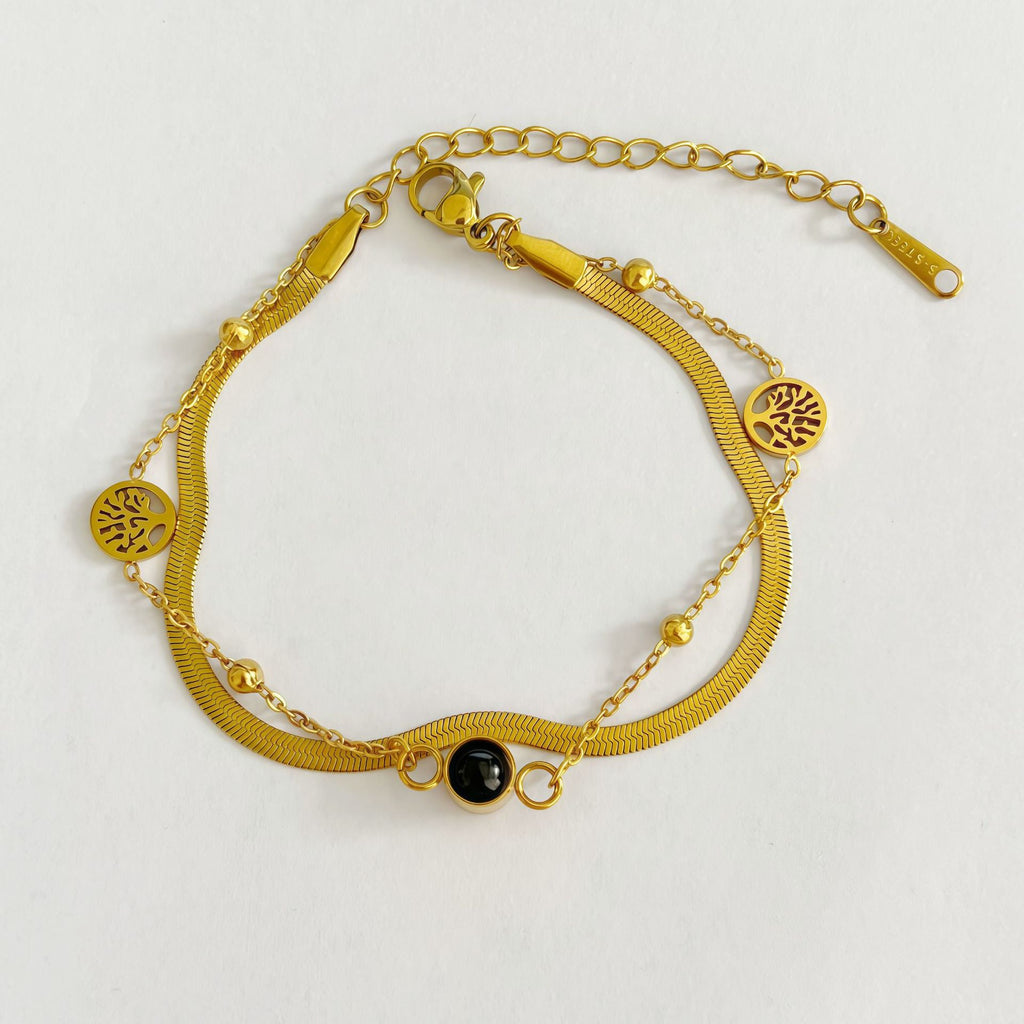 Wall projection effect from custom Tree of Life bracelet
